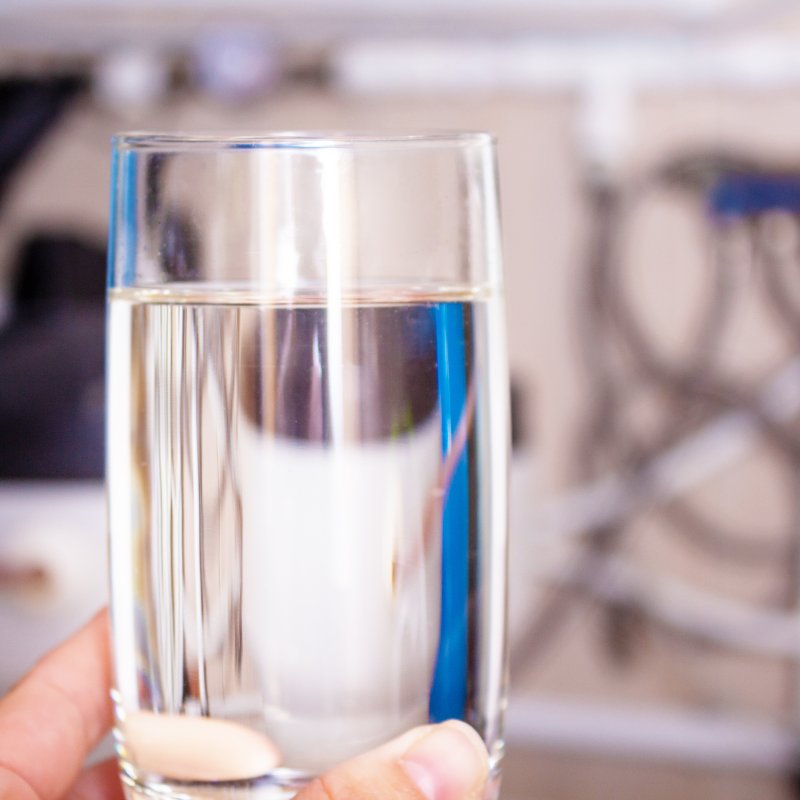 close-up of a clean glass of water in hand