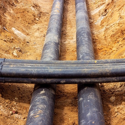 several pipes laying in the ground