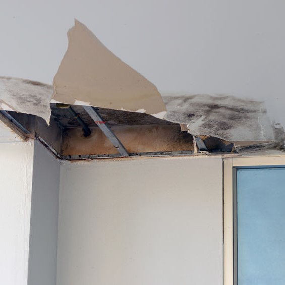 ceiling torn out from a damaged pipe
