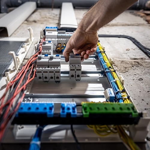 An Electrician Makes an Electrical Repair.