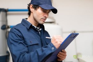 A Plumber Taking Notes on a Plumbing Inspection.