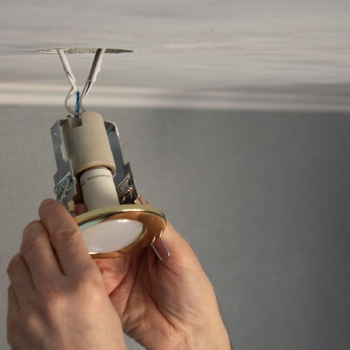 An Electrician Installs Lighting.